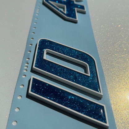 White Malibu Boat Emblem Match with Vapor Blue Metallic Domed Inlay Registration Numbers by Domed Numbers
