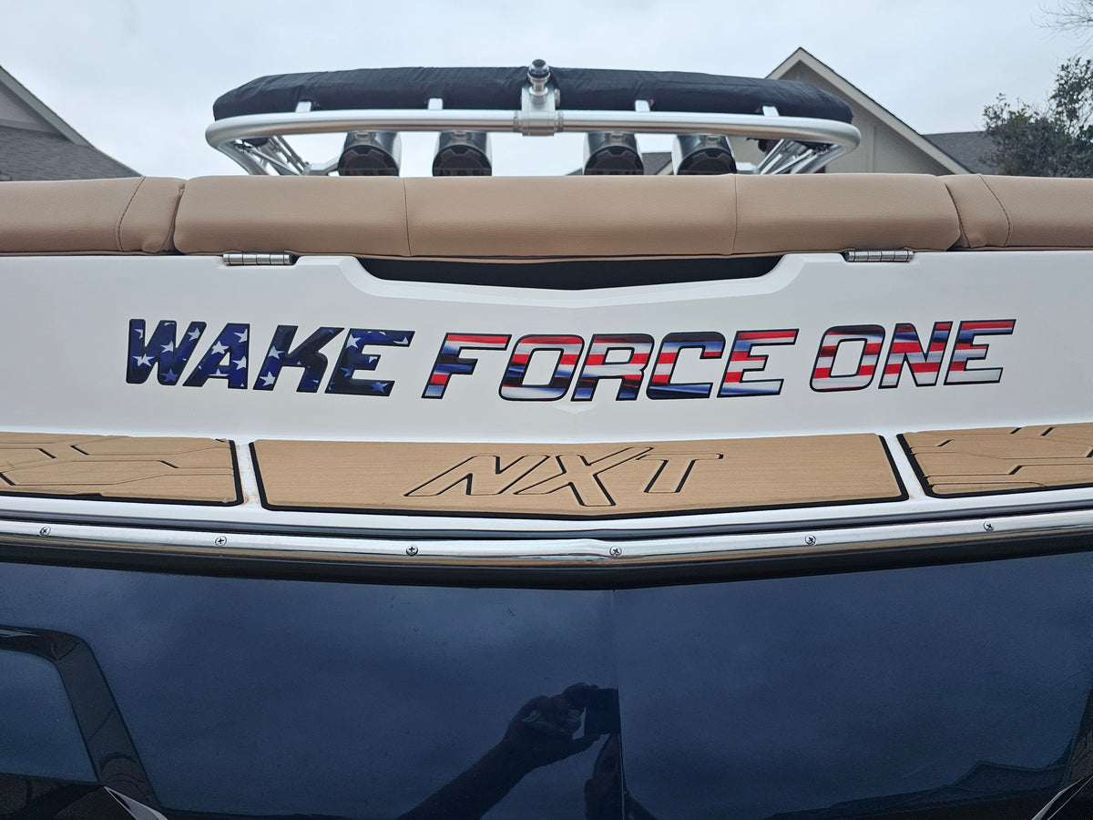 Mastercraft Boat with custom boat name on a clear day.