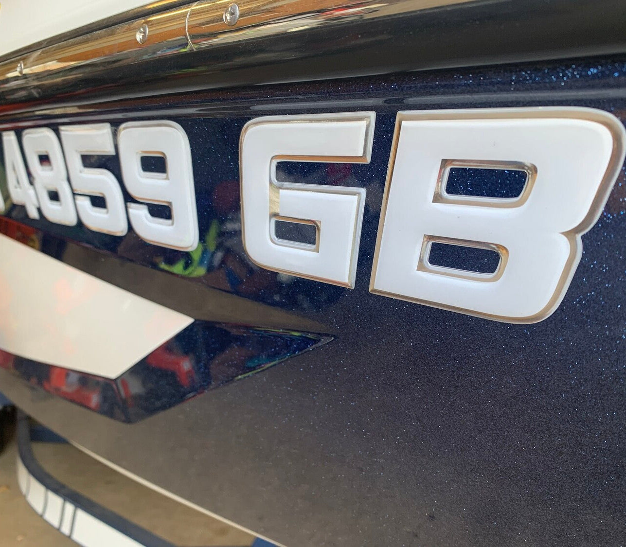 White and Chrome MasterCraft Registration by Domed Numbers