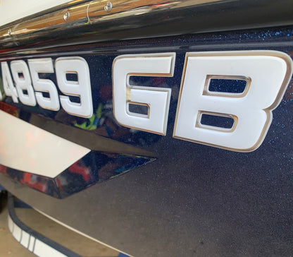 White and Chrome MasterCraft Registration by Domed Numbers
