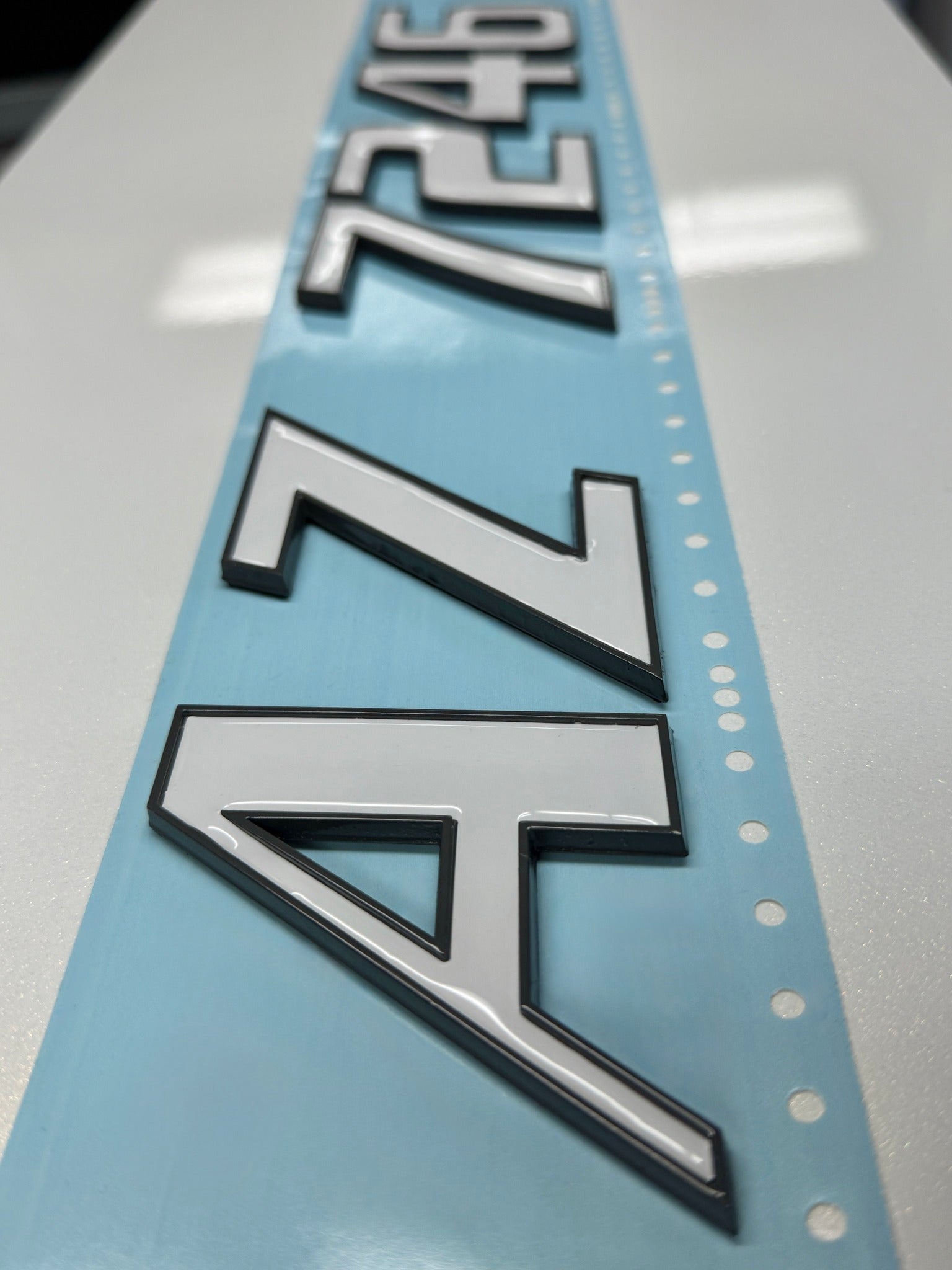 Malibu Boats 3D emblem with a white domed overlay by Domed Numbers